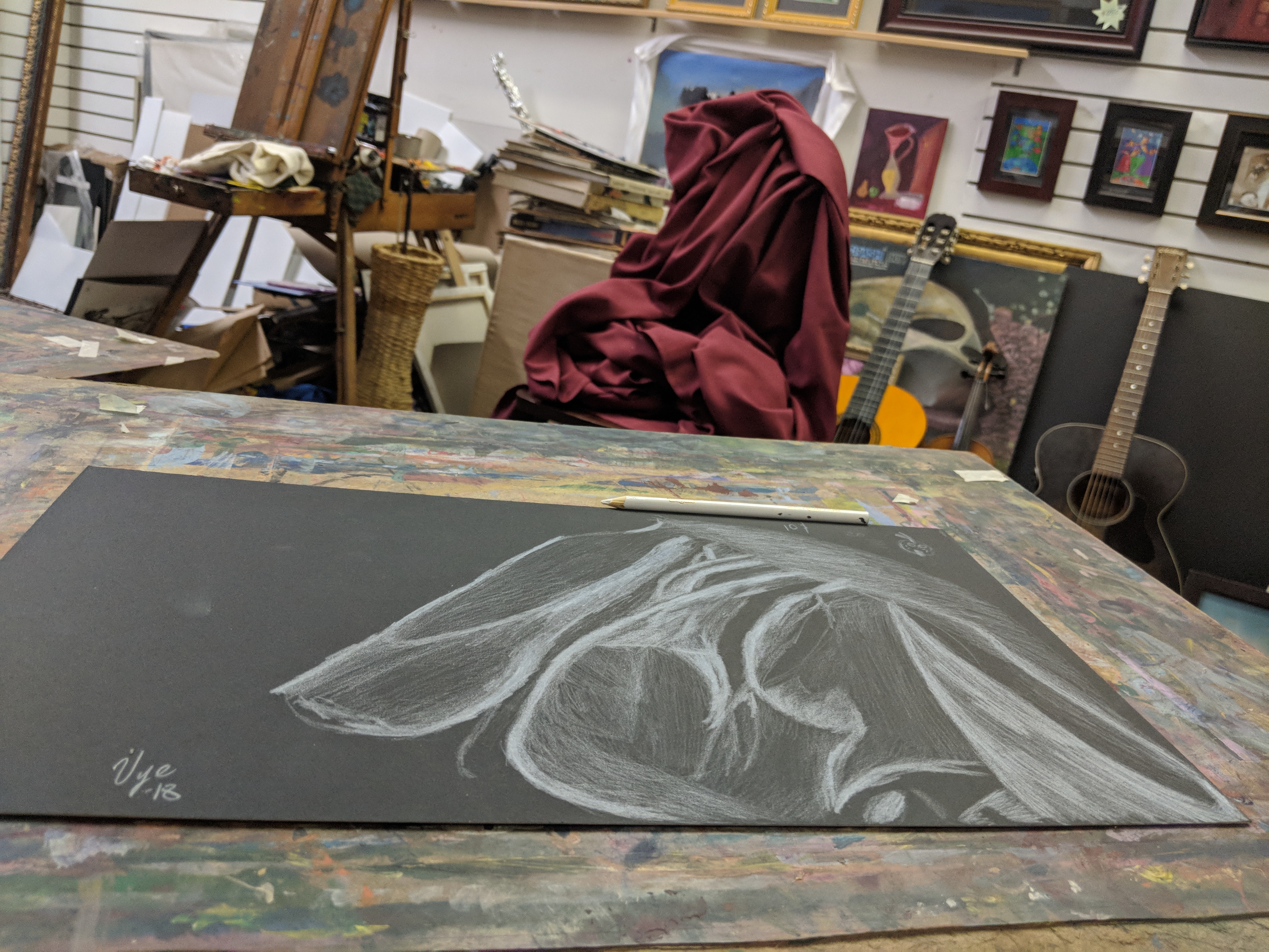 Drawing on black paper from red cloth